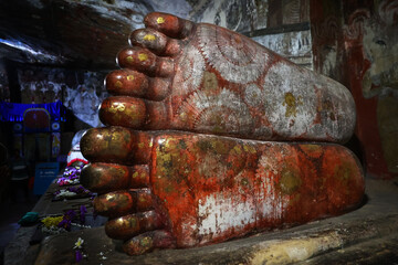Sacred Buddha Footprints in Ancient Cave Temple