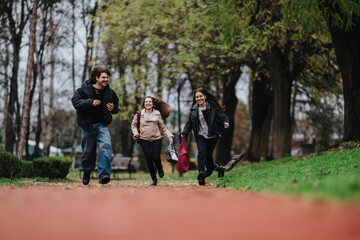 Three teens run along a park path, smiling and playful. Friends enjoy time outdoors in a casual park setting.