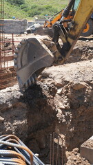 Fototapeta premium Rebar with Excavator and Construction Activity