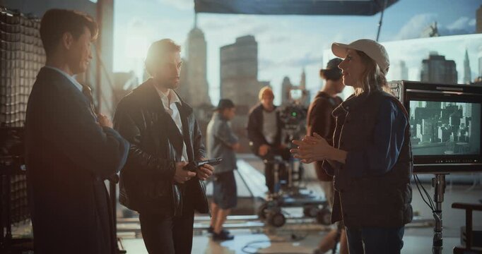 Female Director Briefs Two Male Actors on Rooftop Film Set, Revealing Collaborative Behind the Scenes Directing, Discussing Drama, Acting and Performance, Shot Planning During Movie Production