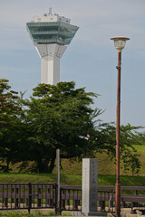 Goryokaku Tower and Stone Monument Framed by Trees in Hakodate