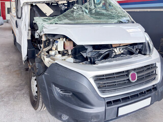 Front View of a Damaged White Van After a Fatal Traffic Accident