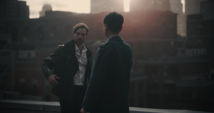 Two Male Criminals Conduct Rooftop Bribe, Exchanging a Cash Envelope and Making a Secret Phone Call in Cinematic Style. Fictional Crime Movie Segment for Screen Replacement, Trailer or Movie Concept.