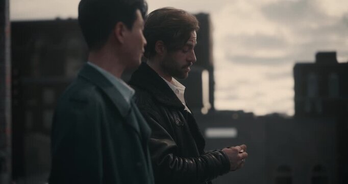 Two Criminals Stand on a Rooftop in Tense Silence as One Examines Kill List, Cinematic Drama Clip. Mock‑up Screen Replacement, Crime Storytelling, Concept Trailer