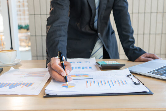 Experienced lawyer providing legal guidance in office, reviewing contracts, documents, finance, justice matters, advising clients during meetings and transactions professionally.