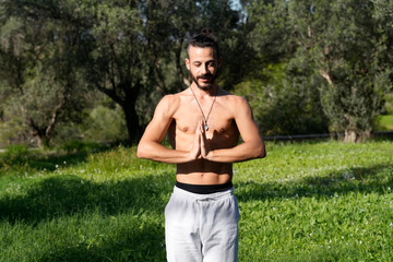 Couple preparing yoga mats for outdoor exercise