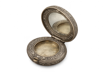 Vintage ornate silver powder compact on transparent background studio shot