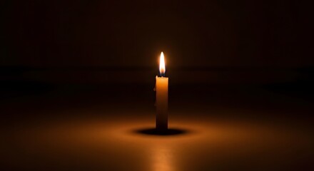 A warm flame honoring victims in a calm scene