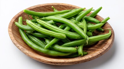 Green beans in a wooden plate on a white background, top view	