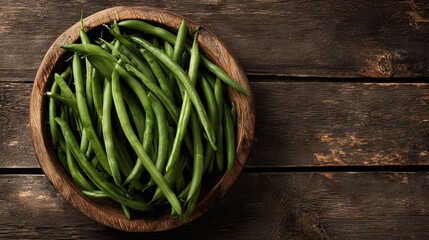 Green beans in a wooden plate on a white background, top view	