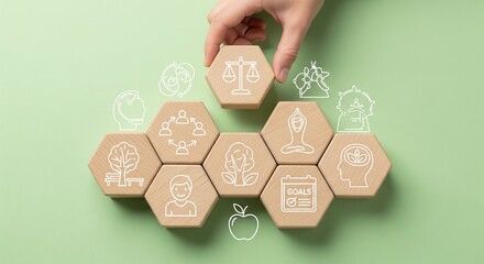 Hand placing wooden hexagon block with scales of justice icon