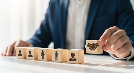 Hand selects handshake block from row of person icons