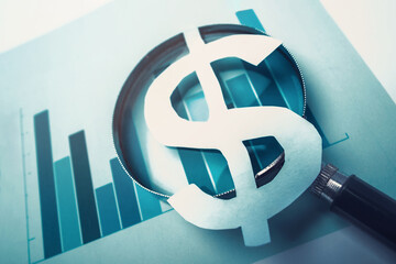 Dollar symbol with magnifying glass placed over financial charts. Market analysis and investment research. Currency value. Business finance strategy.