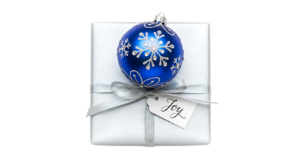 White gift box with blue snowflake ornament and joy tag
