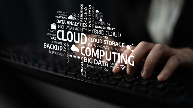 A close-up view of hands typing on a keyboard with cloud computing terminologies in the background, highlighting concepts like data security, analytics, and storage solutions. Tessel