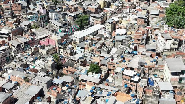 Aerial drone view of Favela Of Cantagalo, Rocinha favelas spread out on the mountain in Sao Conrado , Rio de Janeiro, Brazil.