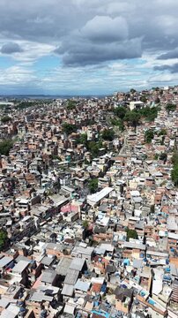 Aerial drone view of Favela Of Cantagalo, Rocinha favelas spread out on the mountain in Sao Conrado , Rio de Janeiro, Brazil.