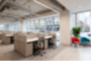 Blurred of Modern office interior with workstations and seating areas