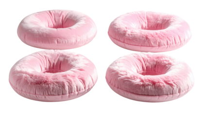Four plush, pink circular objects on a black background, likely pillows, with different textures and slight angle variations