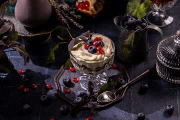 Healthy dessert parfait with berries and pomegranate seeds