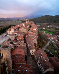 Aerial view of the medieval town of Frias with red tiled roofs.