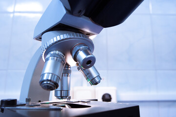 A microscope revolver with objectives of different magnifications for scientific research.