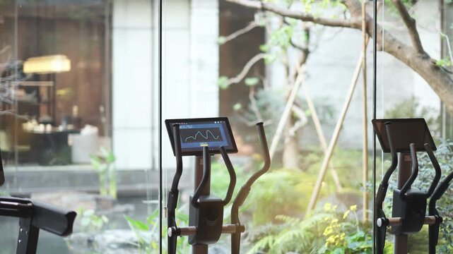 Fitness machine with screen by window