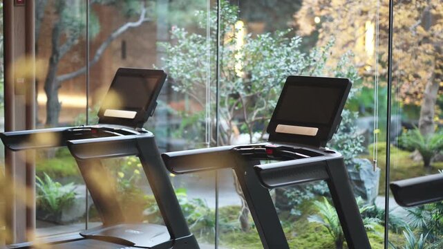 Fitness machine with screen by window