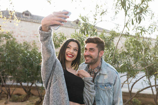 Young couple taking selfi in the city