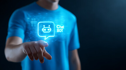 Man touching glowing chatbot icon on blue shirt finger pointing