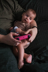 Father and Baby Bonding Over Video Games.