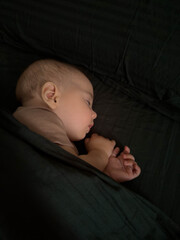 Cute Peaceful Baby Sleeping Under Blanket