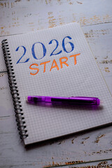 2026 Start text written on white notebook sheet with pen