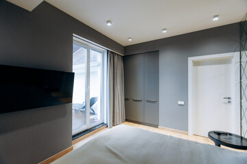 Stylish sleeping area featuring expansive view and modern amenities