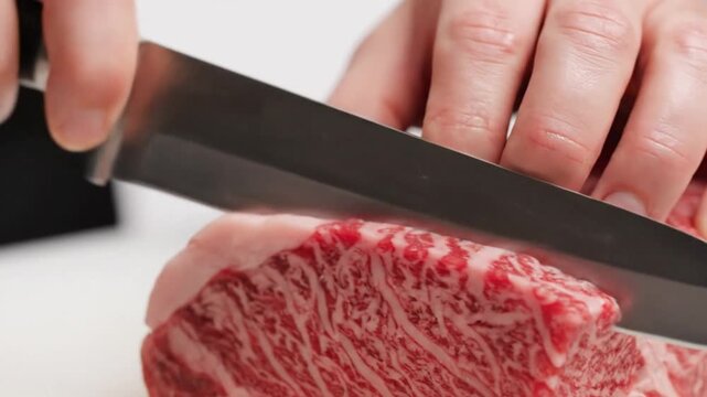 Precision Slicing of Premium Japanese Wagyu A5 Beef with Incredible Marbling and Professional Knife Skills