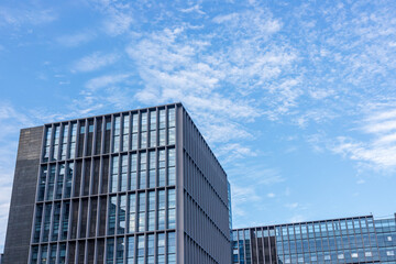 The high-rise office buildings against the blue sky background
