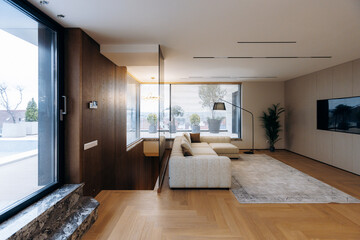Open concept living room illuminated by natural sunlight