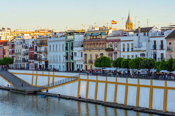 Obraz premium Triana destrict and Guadalquivir river embankment at sunset, Seville, Spain