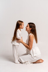 a newborn baby in its mother's arms, the mother soothes the baby before bedtime by rocking it to sleep