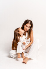 a newborn baby in its mother's arms, the mother soothes the baby before bedtime by rocking it to sleep