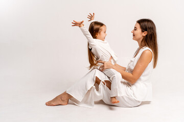 a newborn baby in its mother's arms, the mother soothes the baby before bedtime by rocking it to sleep