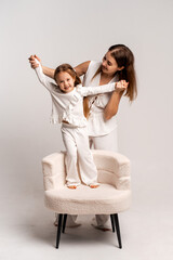 a newborn baby in its mother's arms, the mother soothes the baby before bedtime by rocking it to sleep