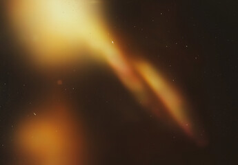 Golden shimmering light in a dark starry night sky. Captivating background suitable for mystical, fantasy, or celestial themed designs.