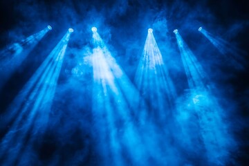 Blue stage illumination with powerful spotlight beams high resolution picture