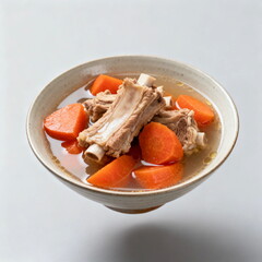 A bowl of carrot and pork rib soup with delicious ingredients