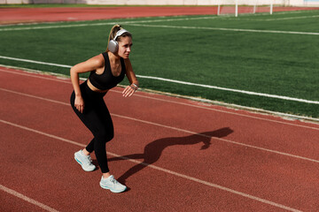 athletic female athlete running on a treadmill	