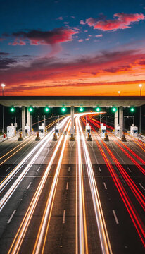 Mesmerizing blue-hour long-exposure highway toll plaza with light trails