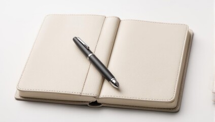 Open notebook with blank pages and a pen resting on top.