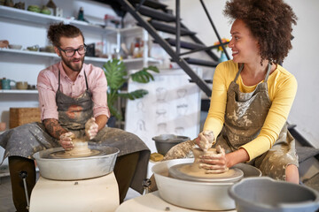 Smiling creative artists making Handmade pottery in studio. Creative, hobby ,workshop  concept