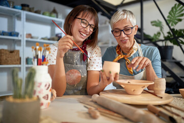 Pottery class of making handmade pot and paint them . Creative, hobby ,activities concept